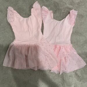 Two pink ballet dresses